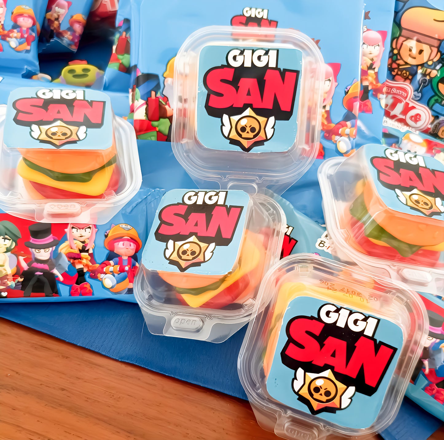 GIGI SAN candy packs with cartoon gamer-themed packaging and colorful hamburger gummies