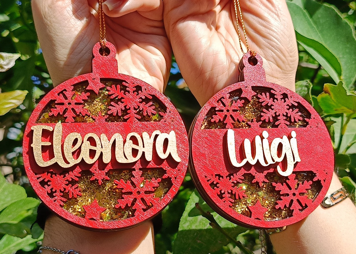 Personalized red Christmas ornaments with snowflakes, gold glitter, names Eleonora and Luigi