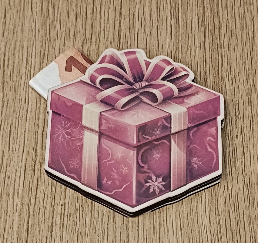 Purple gift box card with a ribbon and euro banknote on wooden surface