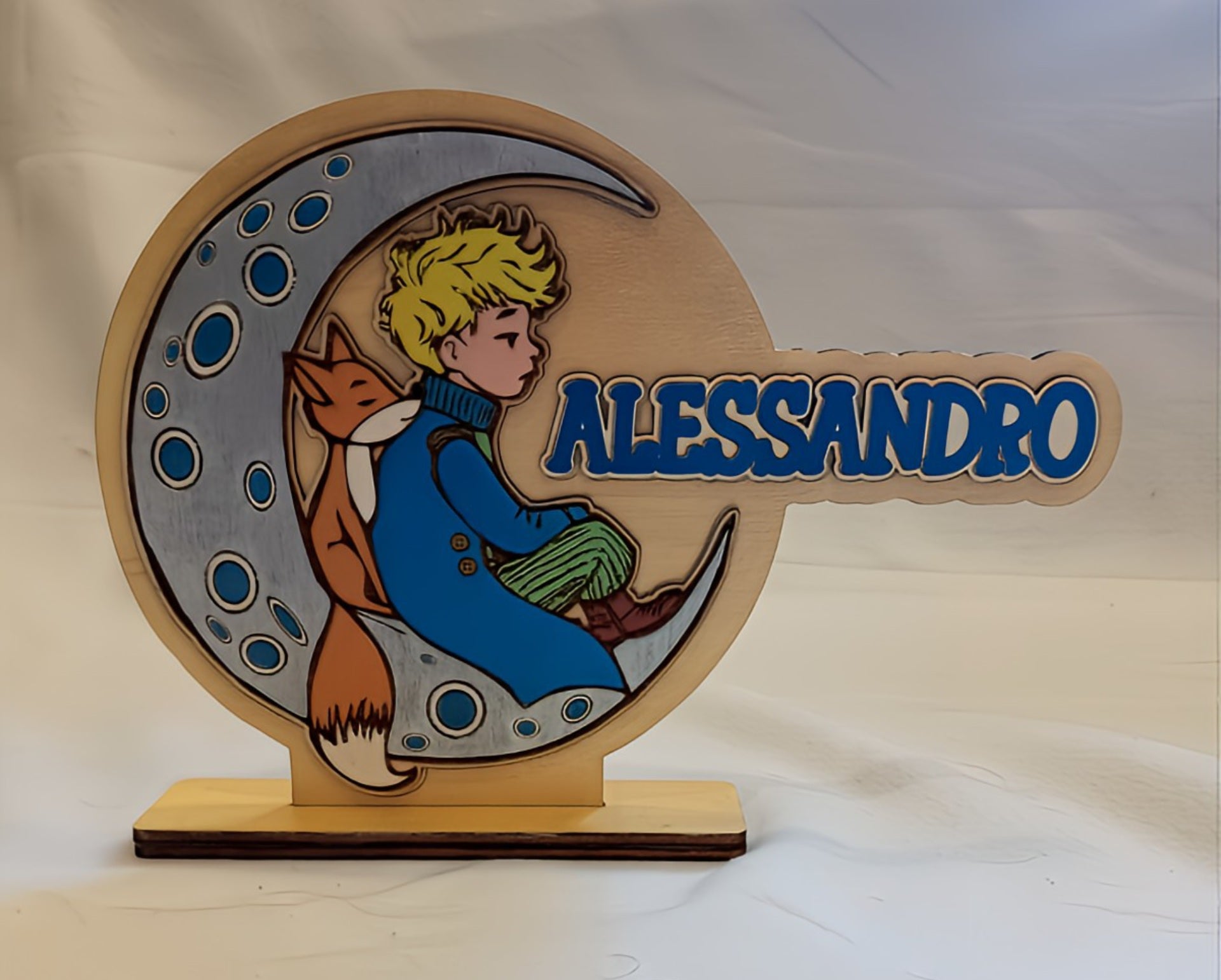 Personalized wooden name sign with boy, fox, and moon illustration, name Alessandro in blue.
