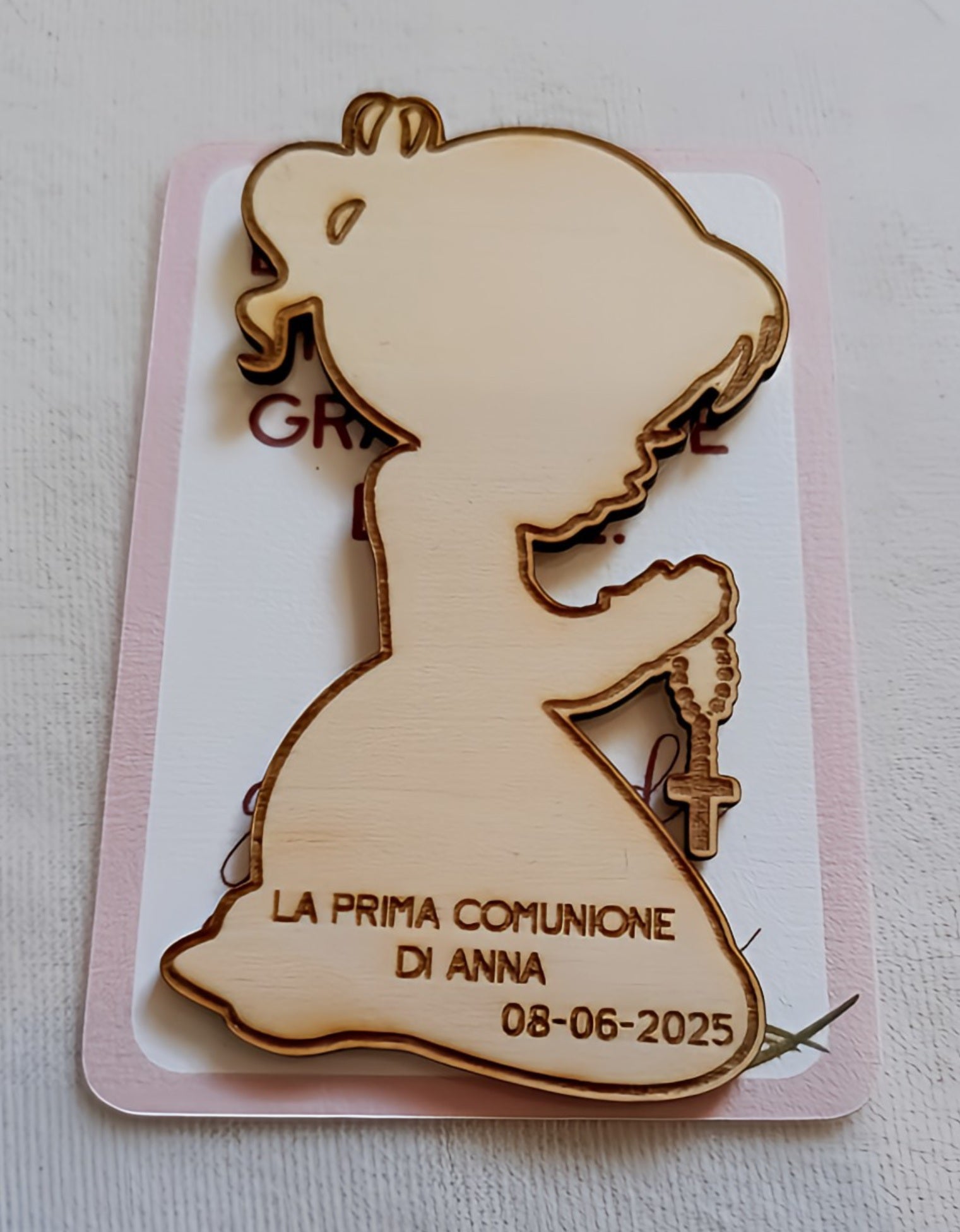 Wooden silhouette of a praying girl with rosary, engraved "First Communion of Anna 08-06-2025"