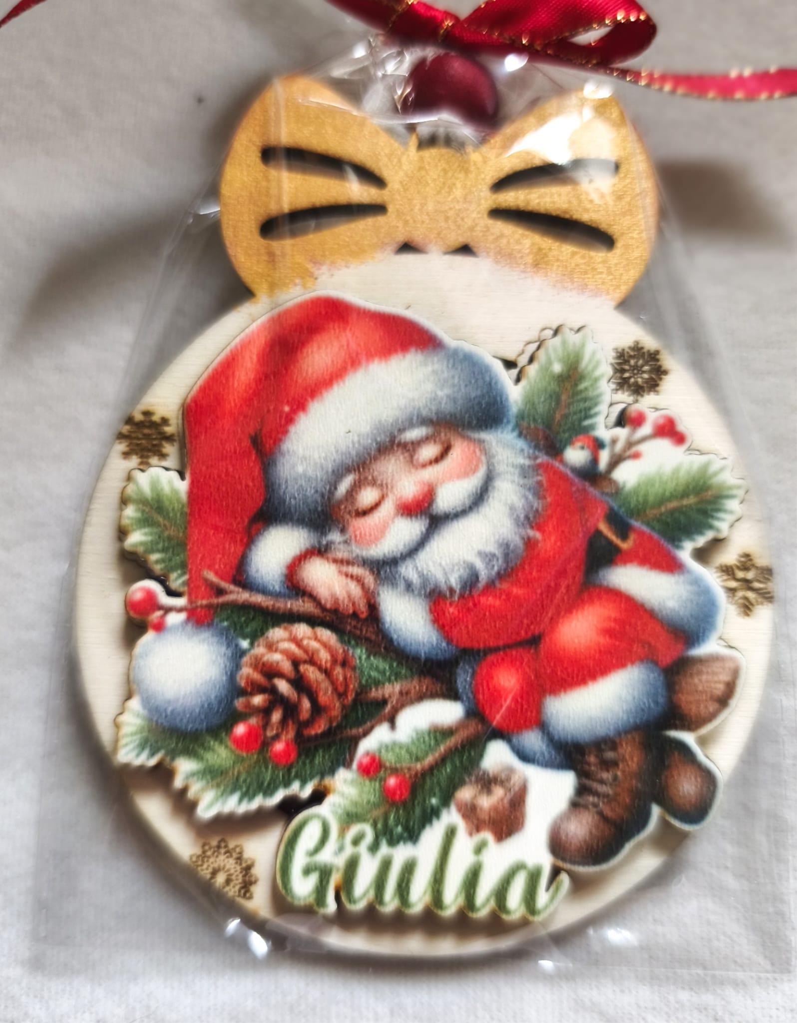 Personalized Christmas ornament with sleeping Santa, pinecone, and Giulia name on wood