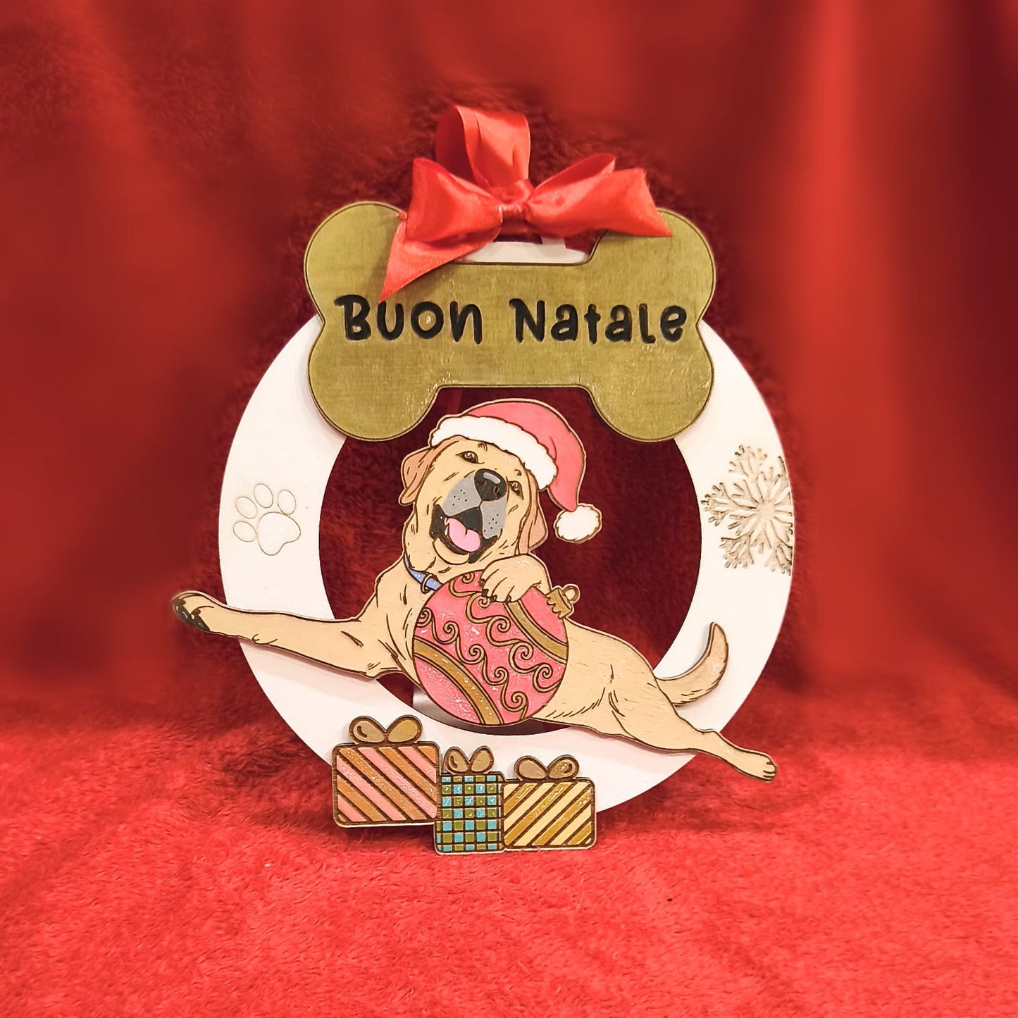 Christmas dog ornament with 'Buon Natale', Santa hat, gifts, red festive background