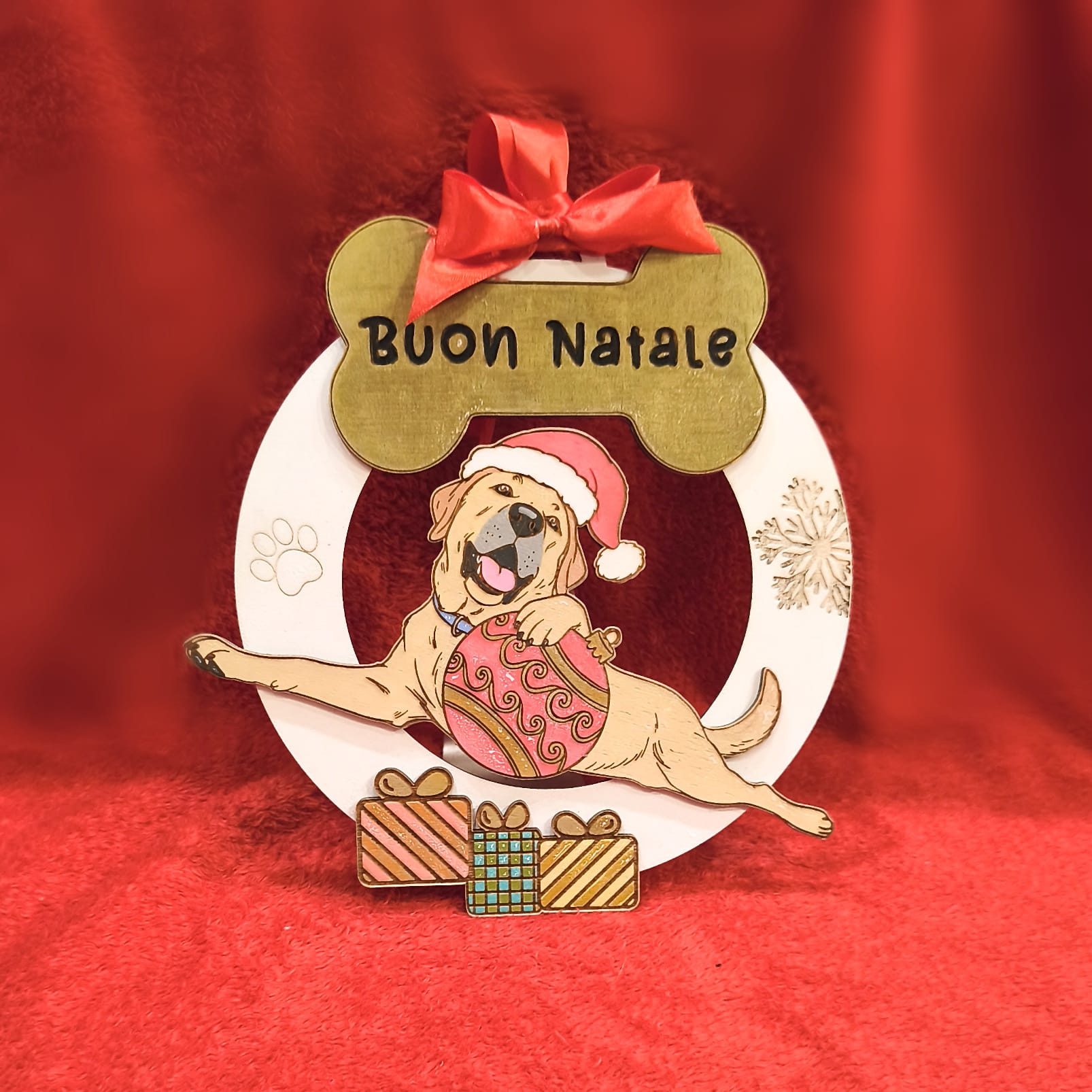 Christmas dog ornament with 'Buon Natale', Santa hat, gifts, red festive background